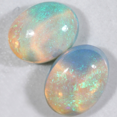 SOLID CRYSTAL OPALS Matching pair, 3D pattern. Bright green fire throughout